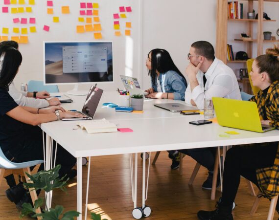 Team sitting around a desk brainstorming