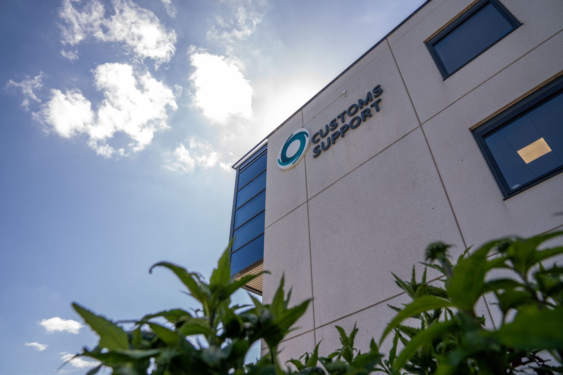 Customs Support Group's HQ photographed against a blue sky