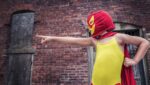 Standing out - a child dressed in yellow and red superhero outfit