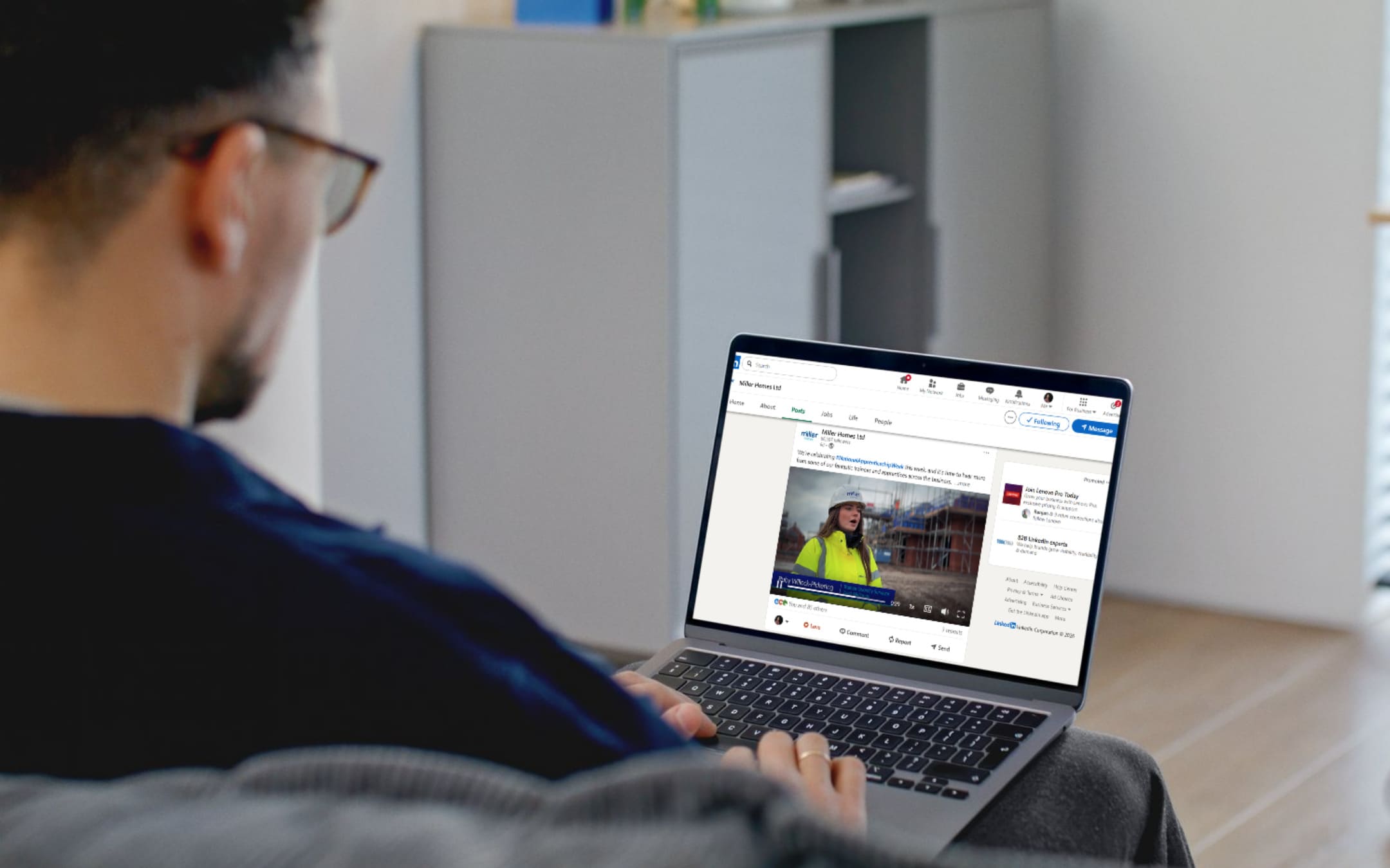Man looking at LinkedIn on a laptop