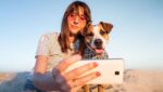 Influencer taking a selfie with her dog