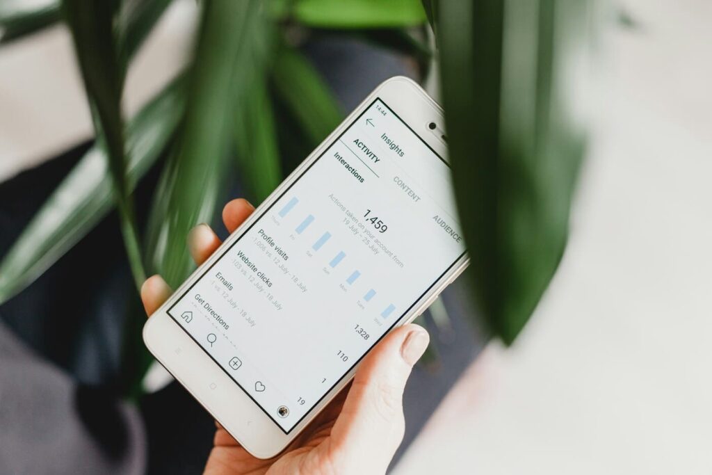 Mobile phone showing social media analytics