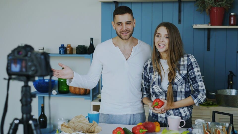Influencers in a kitchen filming a social media video