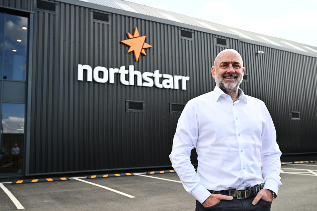 Stuart Godman stands outside northstarr building