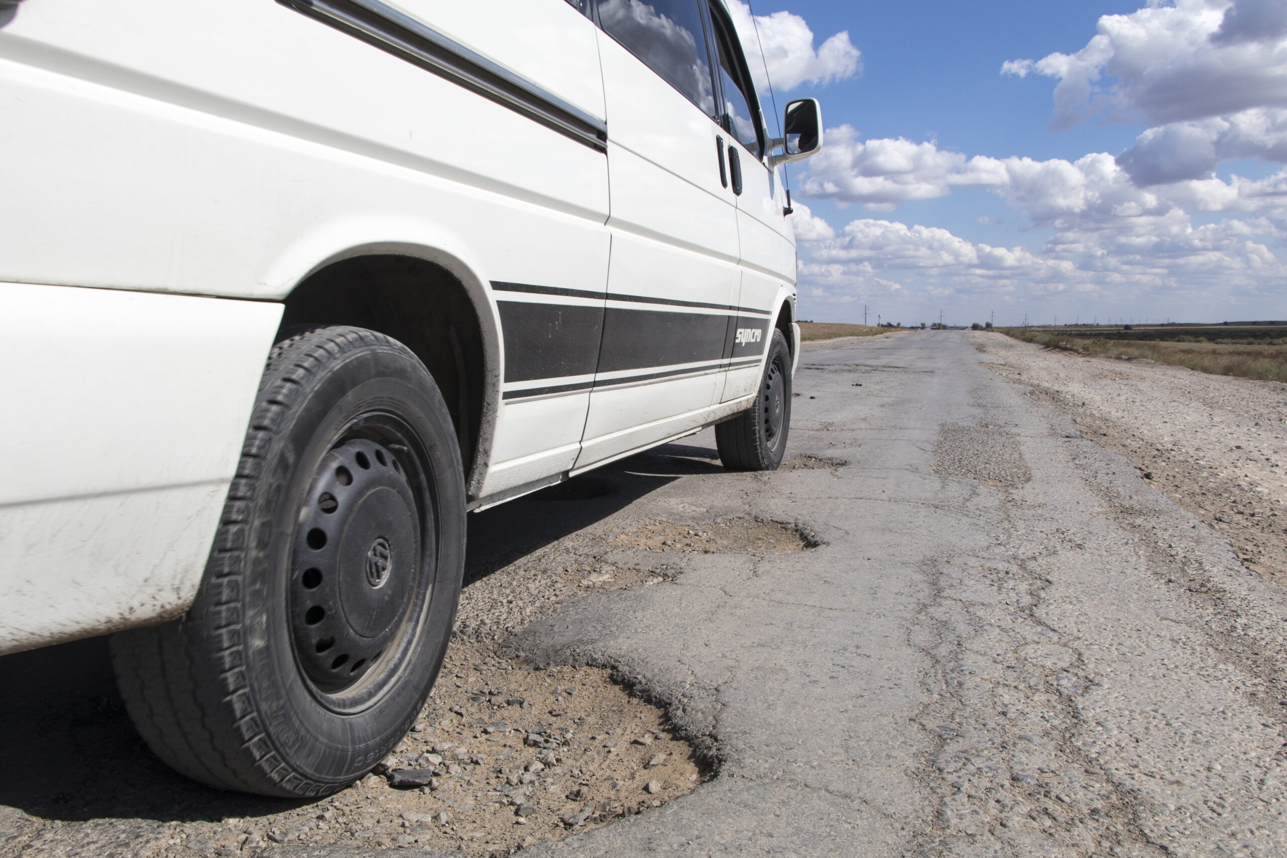 A car driving over a pothole