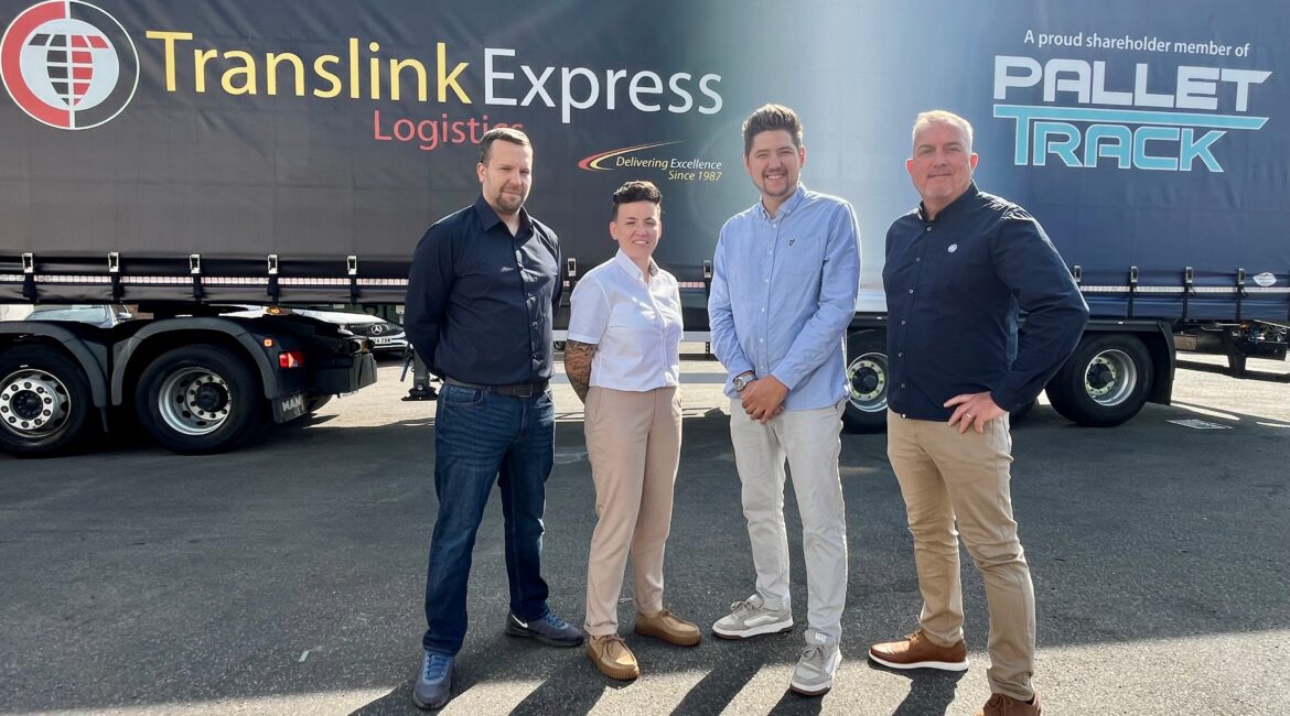 People stood in front of a Translink Express Logistics vehicle