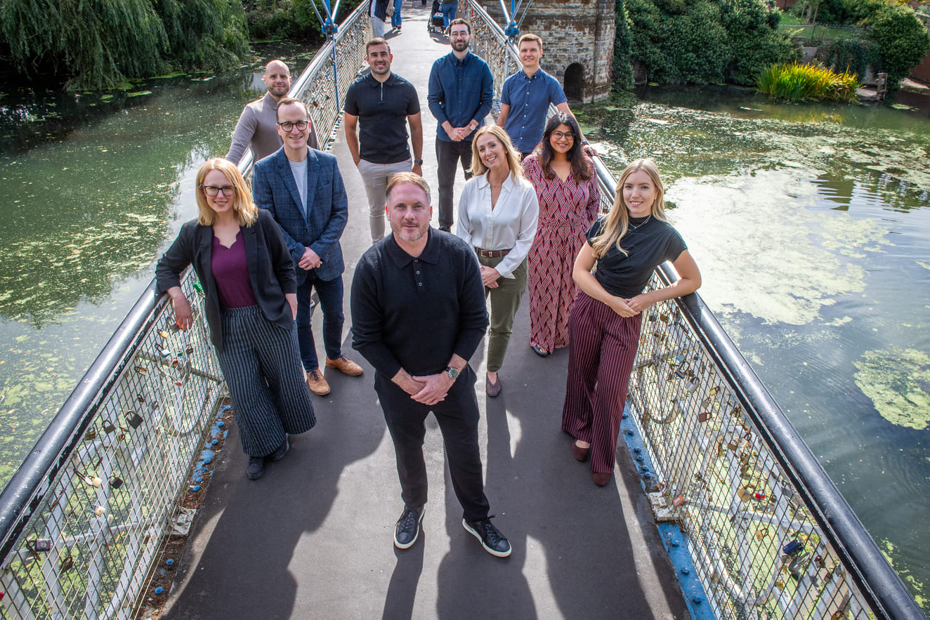 The R&Co Communications digital marketing team standing on Mill Bridge in Leamington Spa