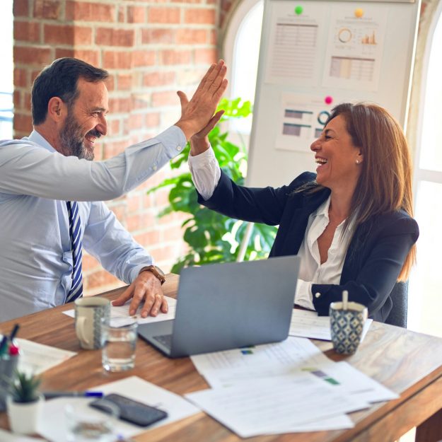 Two colleagues high-fiving