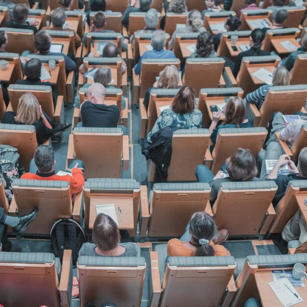 People sitting in a lecture theatre