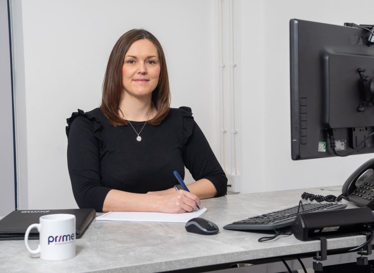 Paislei Godley of Prime Accountants sat at a desk